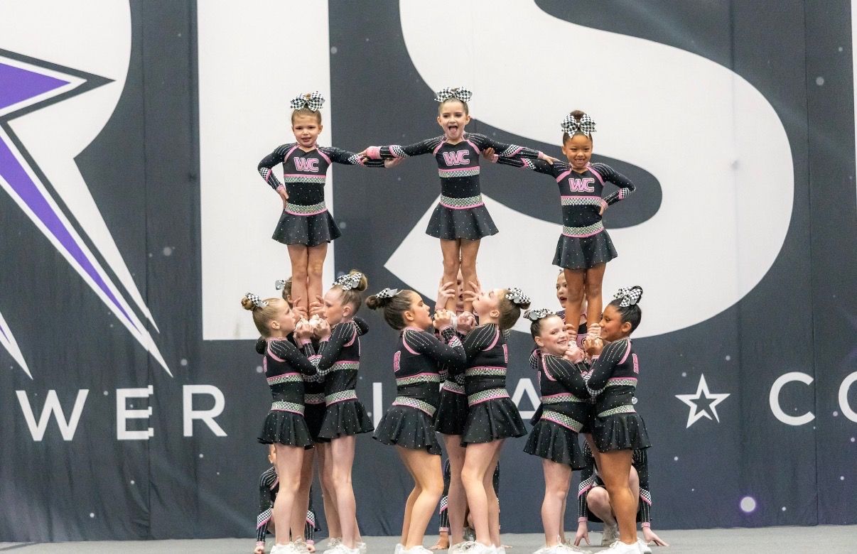 Winner Circle Athletics cheer team hitting a stunt pyramid